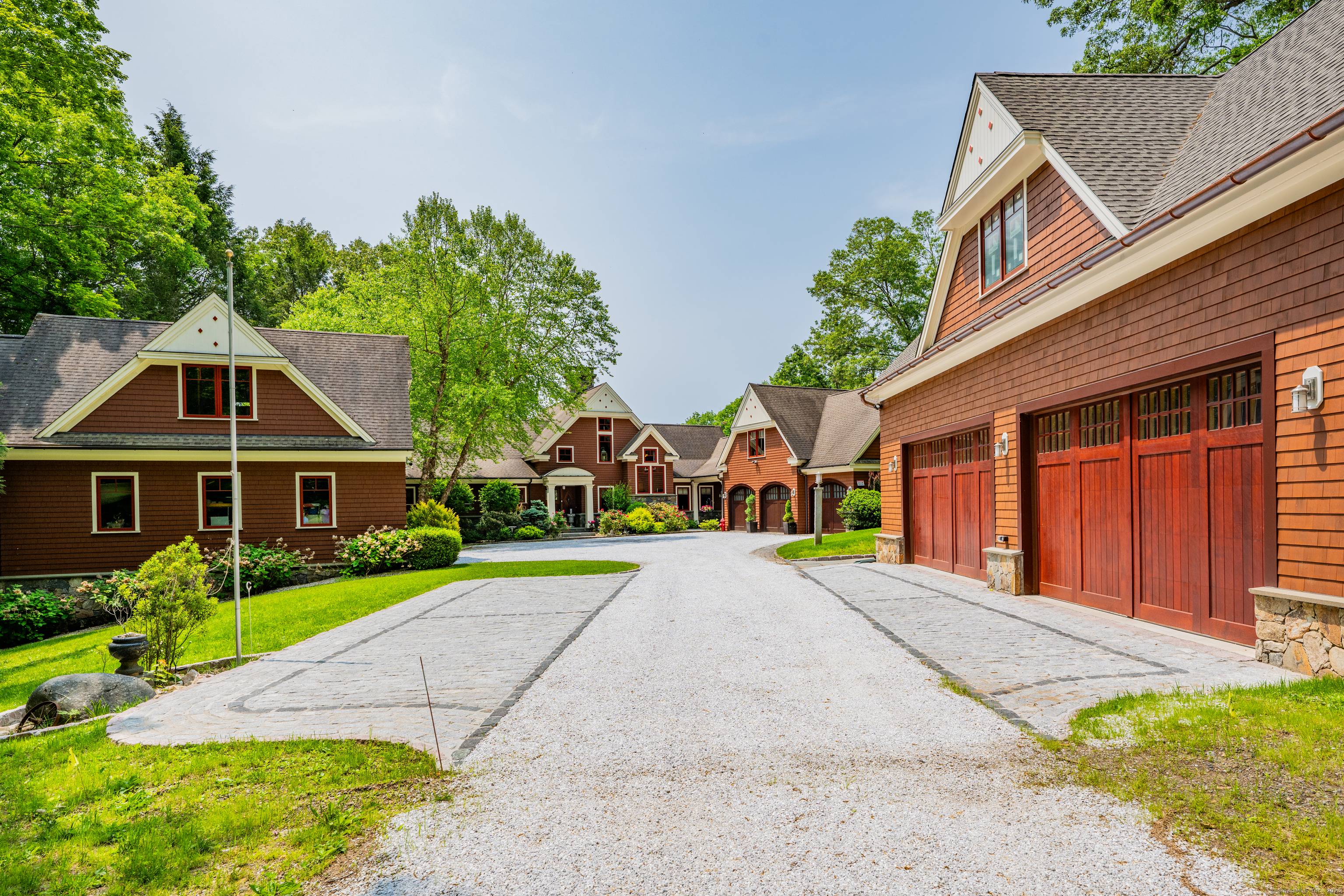 Grand post and beam home with level lake frontage and views, babbling brook, main level master suite, 9 car garage, finished walk out, and unfinished loft spaces for potential for ...