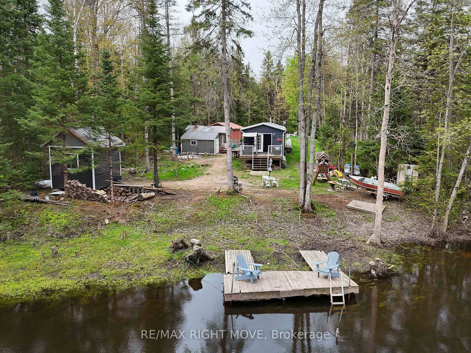 Welcome to 6593 Pioneer Village Lane your peaceful riverside escape on the scenic Black River !
