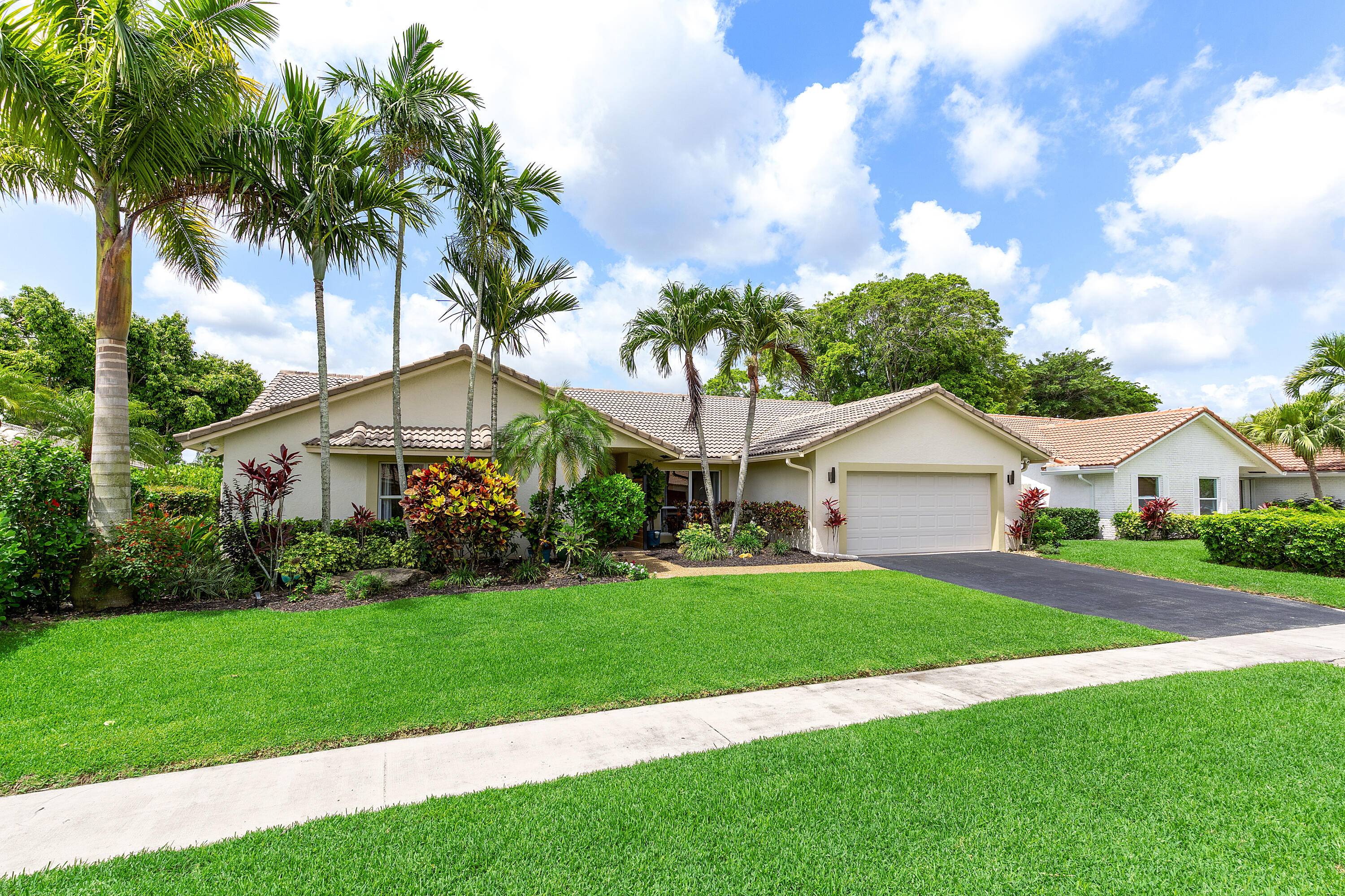 Step into luxury with this exquisite lake and golf front home, where a stunning south facing backyard invites endless sun soaked serenity.