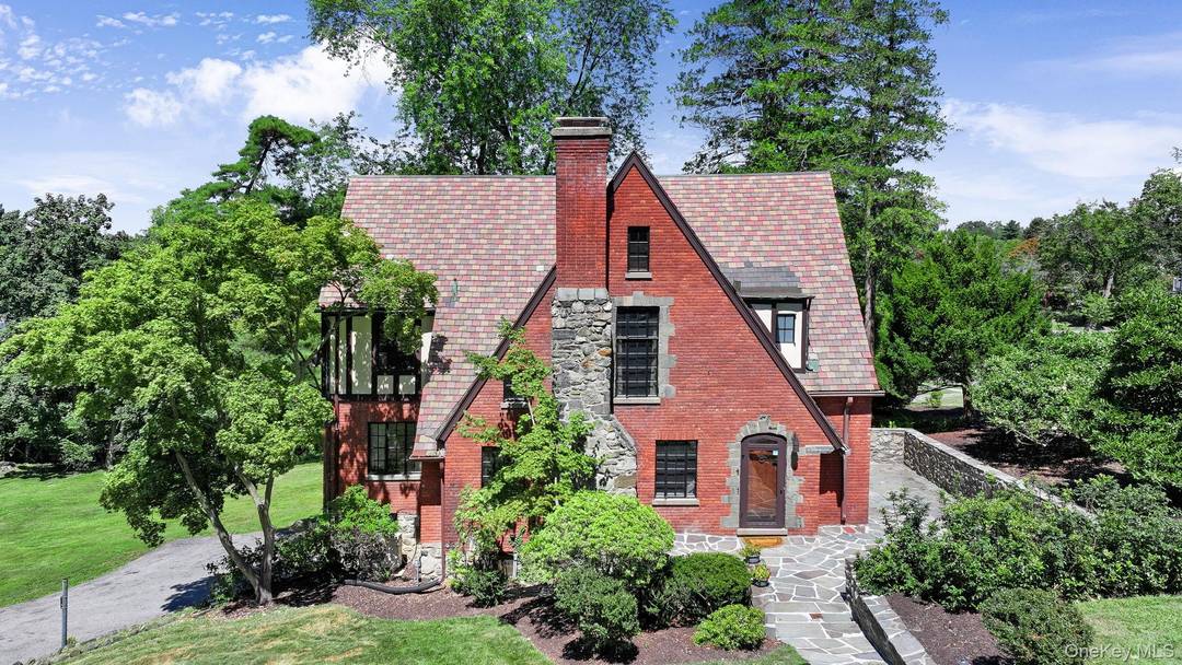 Step into this charming 1930 Tudor style home in the heart of Poughkeepsie, where timeless character meets generous living space.