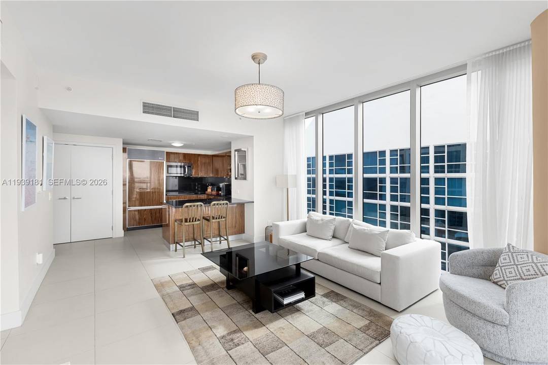 Welcome to Residence 1509 a sleek and modern corner residence in the prestigious North Tower at The Carillon, Miami s premier oceanfront wellness resort, formerly known as Canyon Ranch.