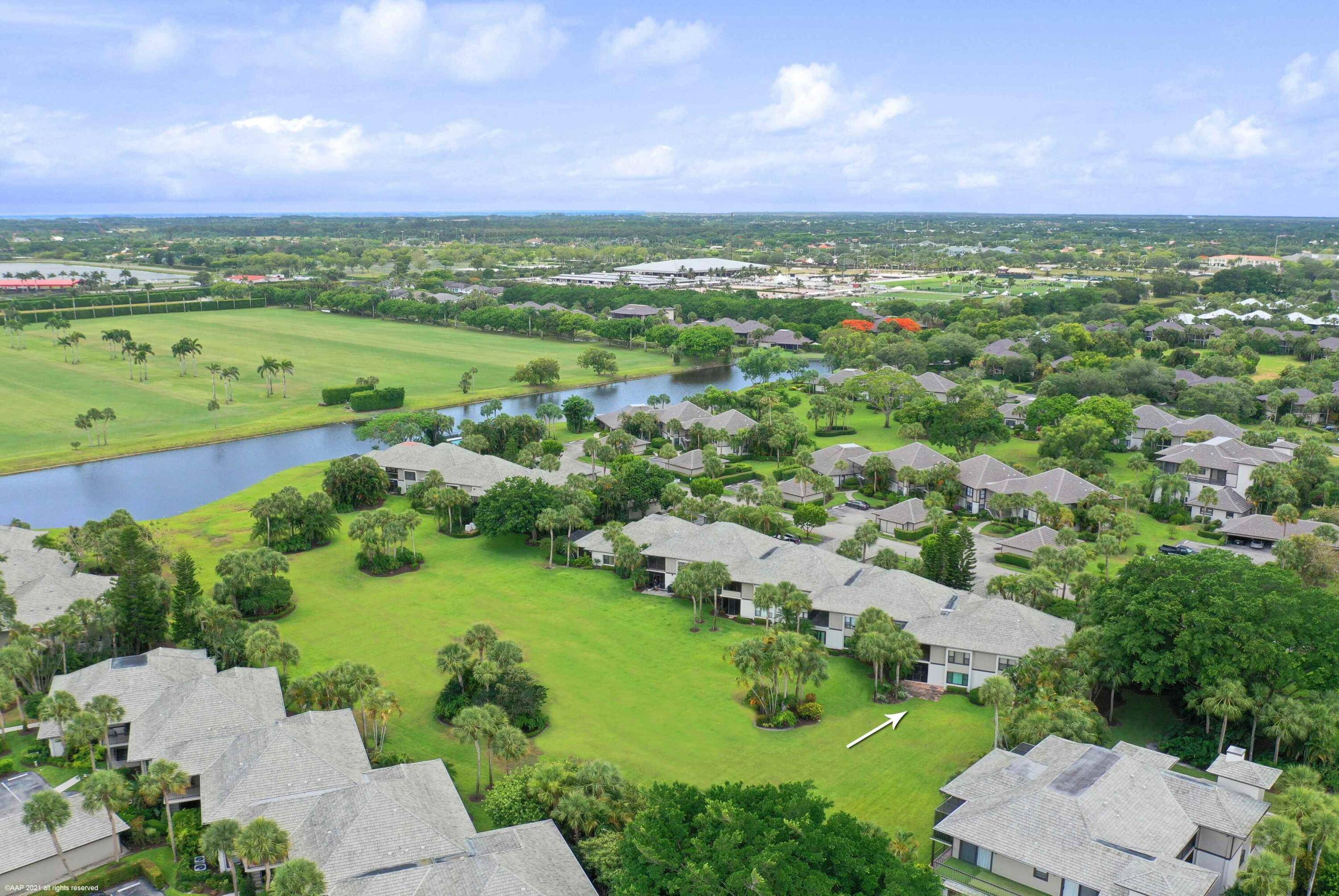 Beautifully renovated Meadow Brook first floor, end unit condo in the Palm Beach Polo Club.