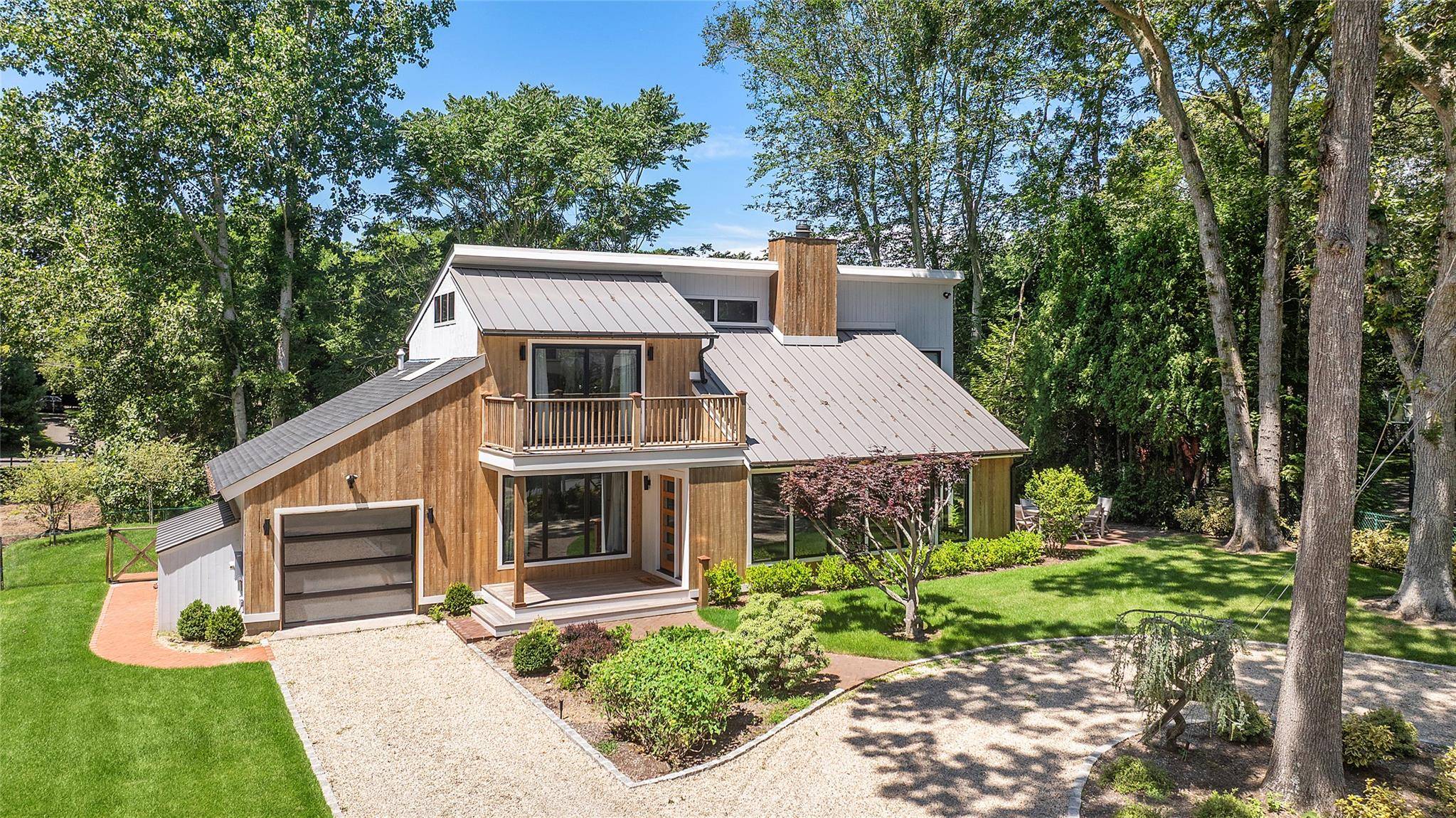 Welcome to this stunning, newly renovated contemporary home in the desirable Redwood section of Sag Harbor Village.