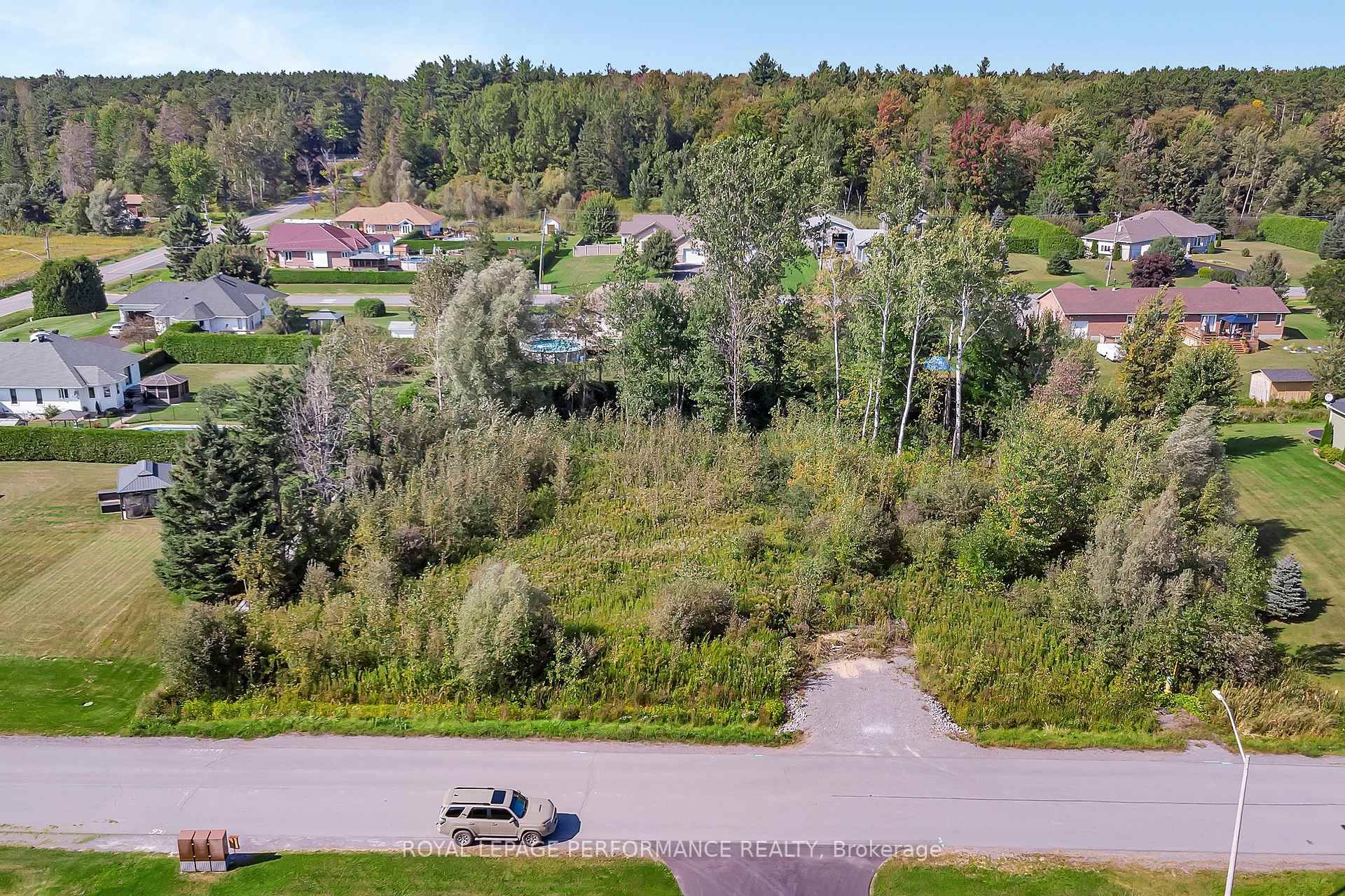 Ready to build ! This large 3 4 acre flat and treed lot offers privacy and the perfect spot to build your dream home.