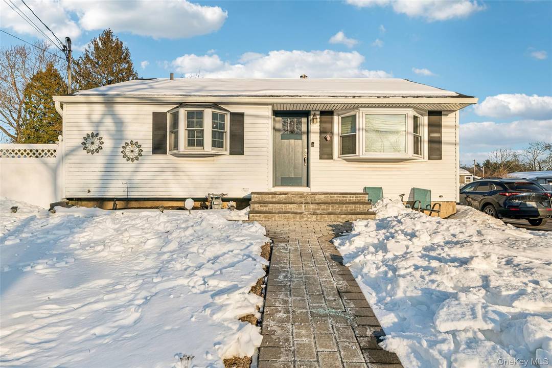 Welcome home to your move in ready ranch in Sachem East School District with LOW TAXES !