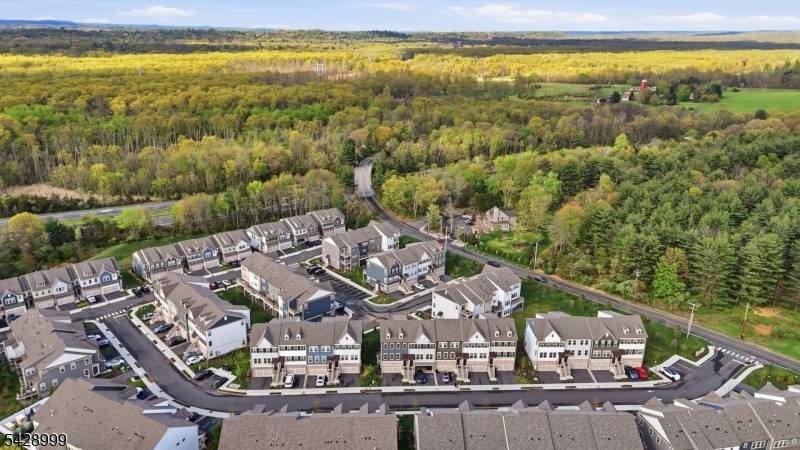 Experience elevated living in this impeccably designed end unit townhome, nestled within the prestigious Fairview at Warren community.
