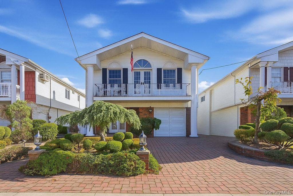 Welcome to this beautifully maintained Hi Ranch located in the heart of Howard Beach, offering the perfect balance of comfort, space and modern updates.