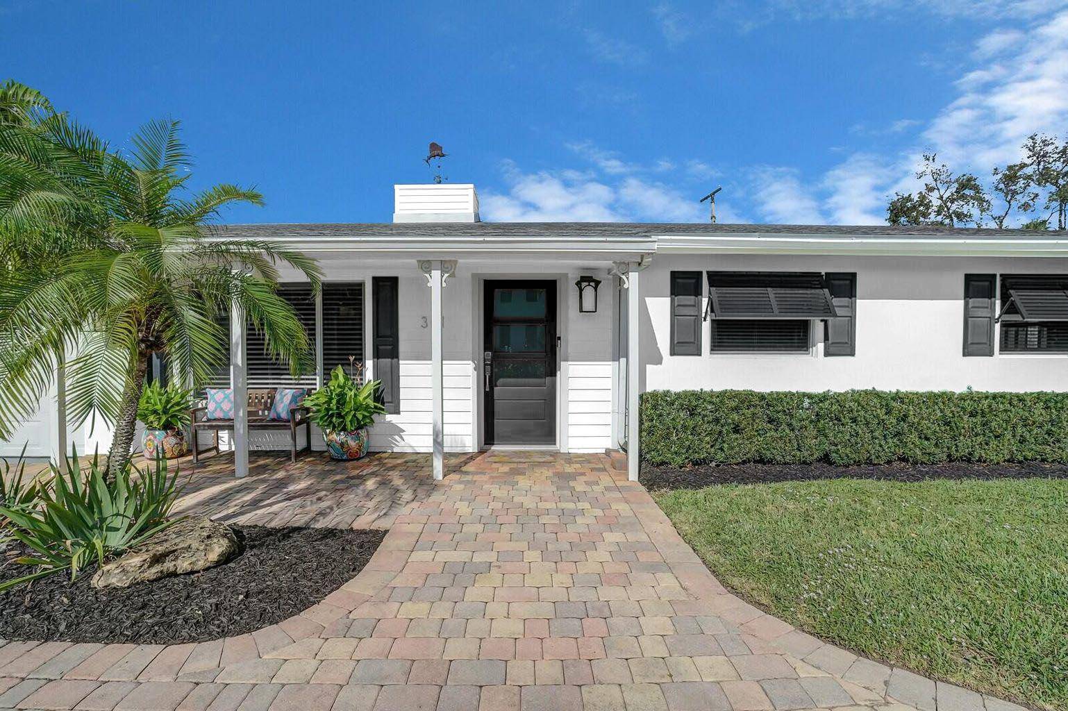This charming Key West inspired 3 bedroom, 2 bath home in Delray Beach's Lake Ida neighborhood blends coastal style with practical updates.
