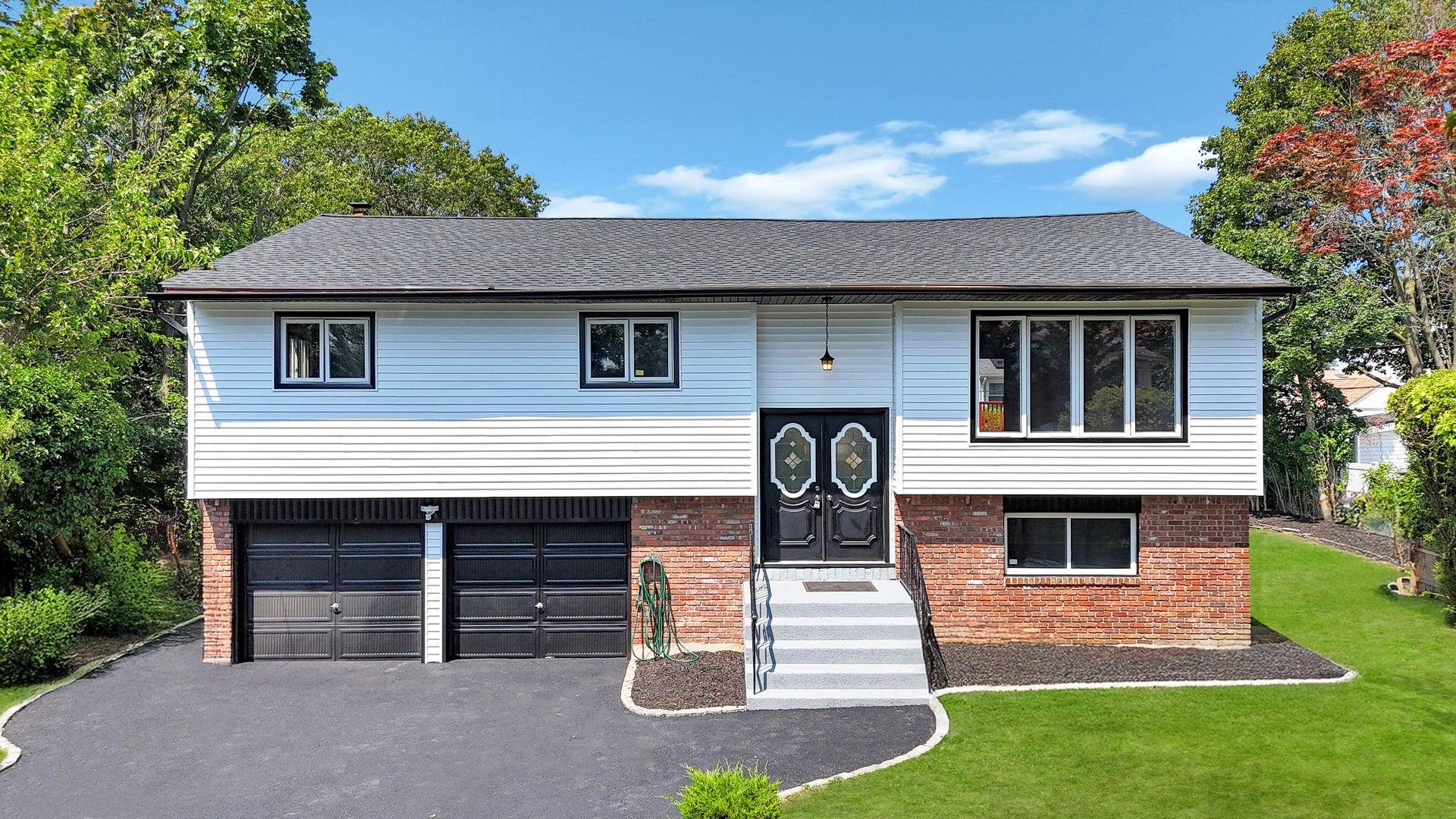 Welcome to this Stunning amp ; Spacious Hi Ranch in East Meadow, perfectly suited for large or extended families.
