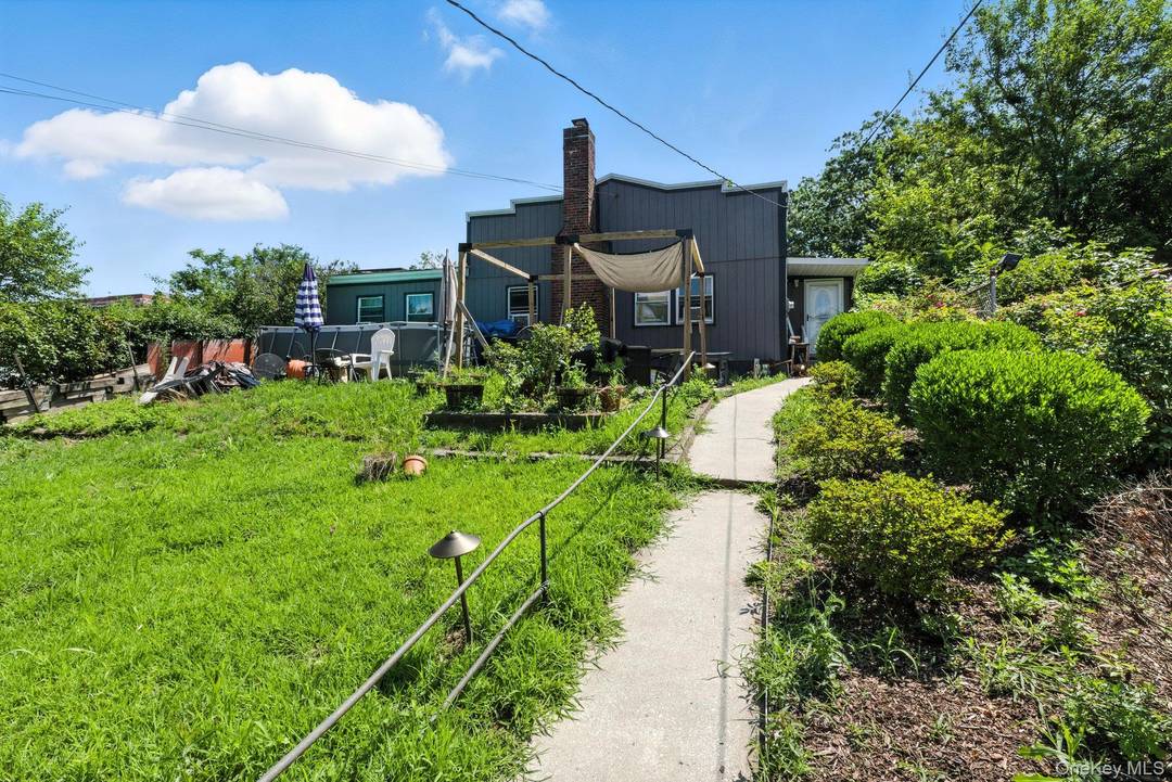 Welcome to 3312 Barker Ave, a well maintained single family home on an oversized lot in The Bronx.