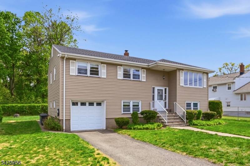 MOVE RIGHT IN WITH COMFORT AND STYLE TO THIS CHARMING 4 BED SPLIT LEVEL.