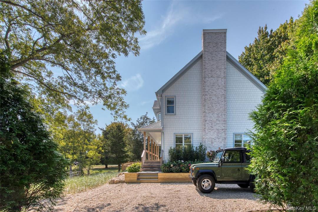 This beautifully renovated 4 bedroom den and office waterfront home house is not in a flood zone offers a seamless blend of modern comfort and timeless coastal style.