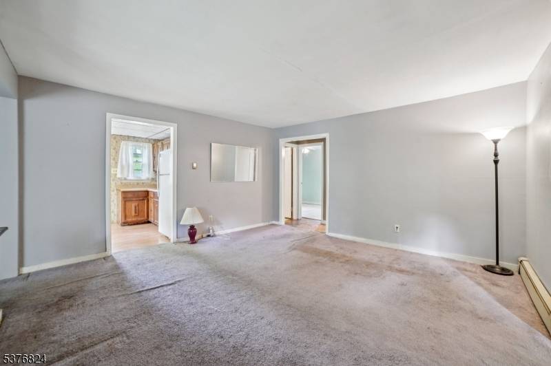 Located in the desirable lake community of Rock Ridge, Denville, this home has three bedrooms, one bathroom and a large front yard.