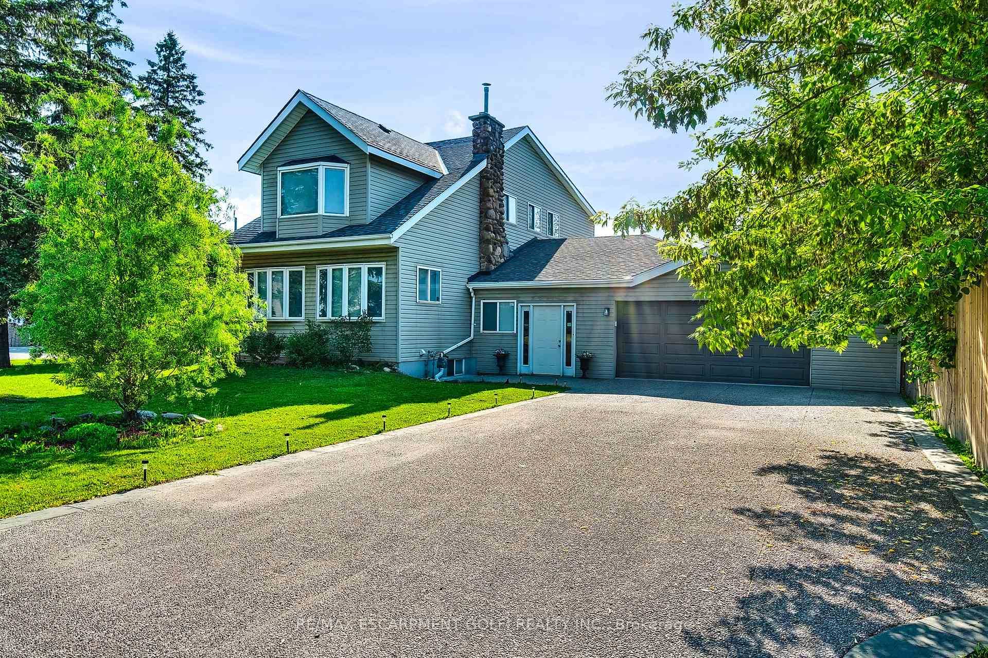 Welcome to 322 Jones Road a fully renovated legal duplex on a massive 90x180 ft lot in Stoney Creek, zoned for residential and commercial use.