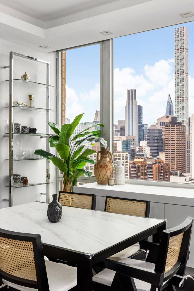 Through 10 foot walls of glass, the city stretches before you from One World Trade Center to Central Park and the George Washington Bridge.