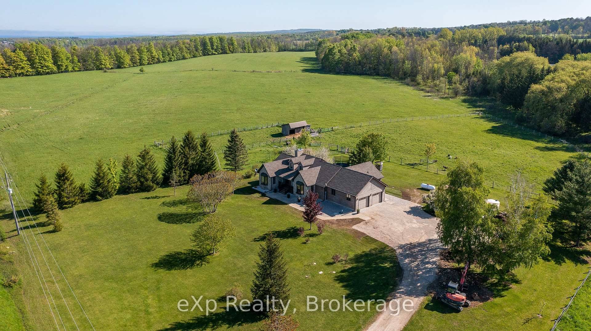 Welcome to this stunning country bungalow set on nearly 20 acres of rolling countryside, just 5 minutes from all the amenities of Owen Sound !