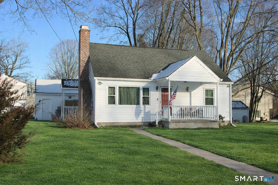 Charming Cape situated on a level corner lot, ideally located close to downtown Bethel.