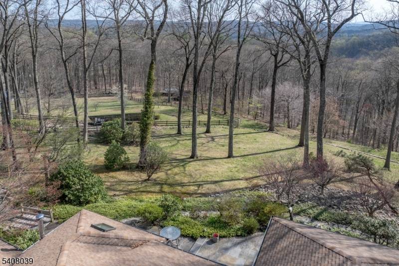 Extraordinary custom home with stunning long countryside views to the south.