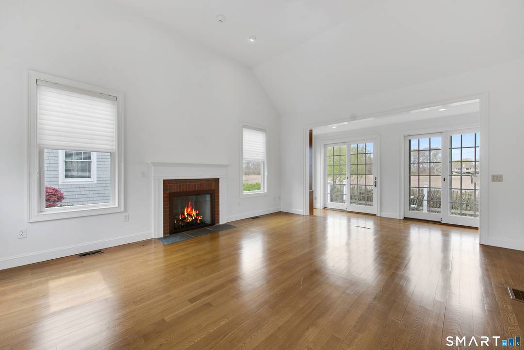 Nestled along the serene shores of North Cove, this exceptional 2, 300 square foot detached shingle style condo perfectly blends coastal elegance with unmatched privacy.