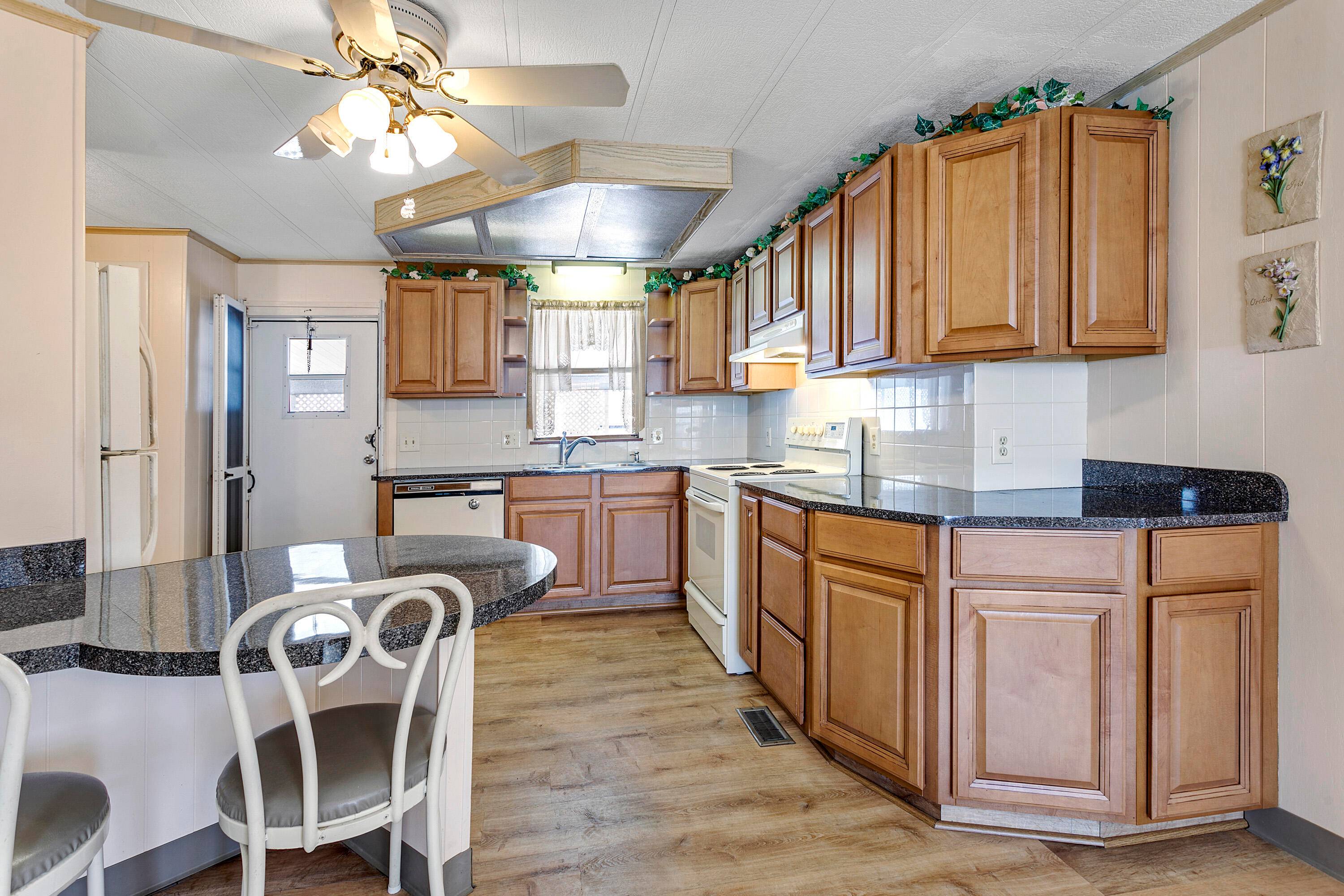This charming 2 bedroom, 2 bathroom home is located in a desirable Active Adult community with a 24 hour manned gate for added security.