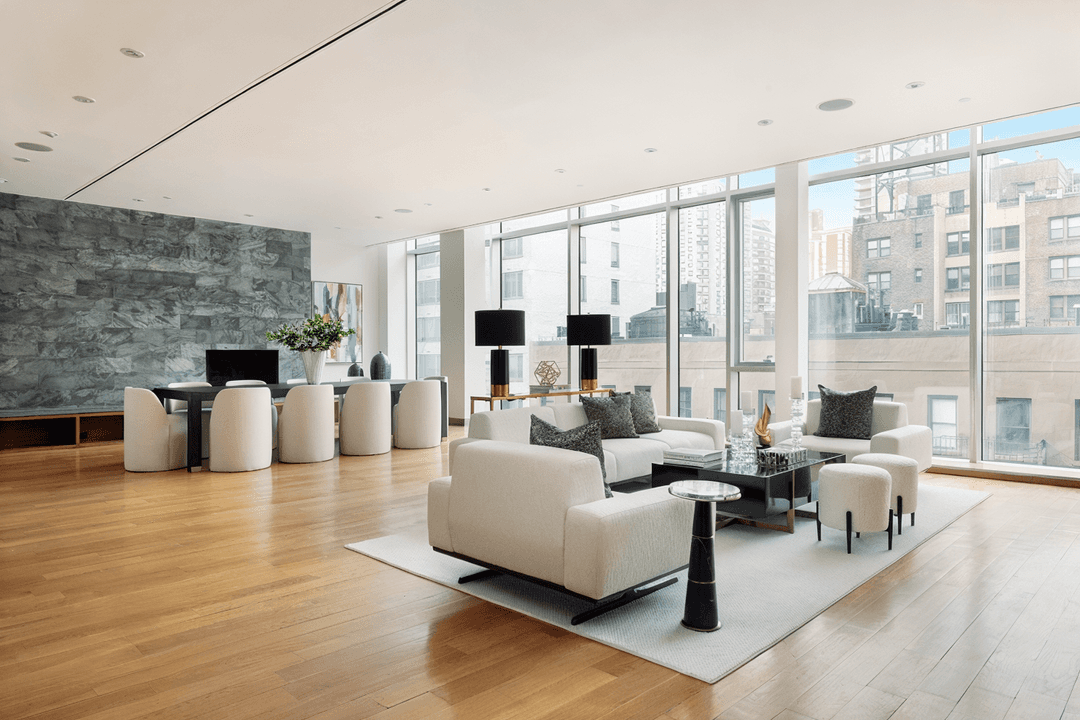 This TRIPLEX PENTHOUSE located on the Upper East Side in a private full service CONDO building is something to be seen.