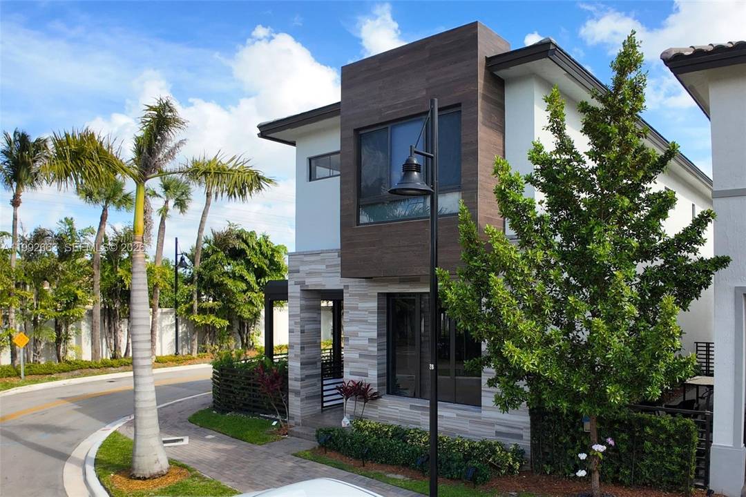 Built in 2023, this corner lot residence in Doral delivers a rare combination of privacy, efficiency, and elevated everyday living.
