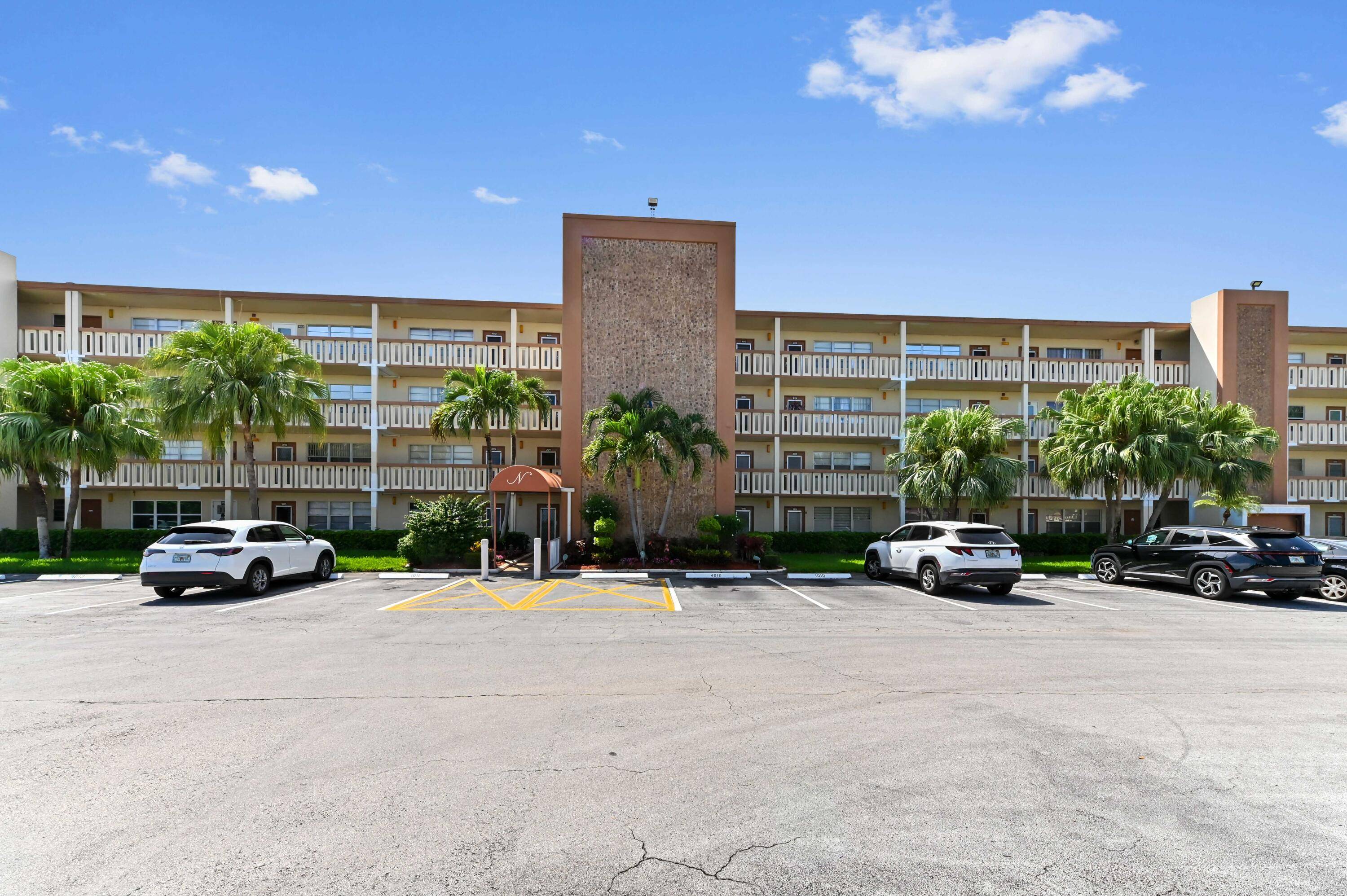 Welcome to this charming main floor unit in a gated, manned, 55 community, perfectly nestled in a 4 story waterfront condo overlooking a tranquil lake.