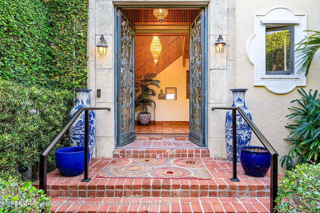 Quintessential Palm Beach Living tucked behind the hedges in a coveted island setting.