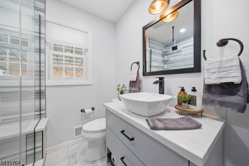 Exceptional and beautifully maintained two family residence offering space, style, and modern upgrades throughout.