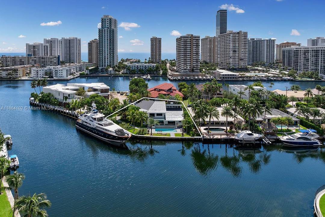 Welcome to an extraordinary, one of a kind waterfront estate in the exclusive gated enclave of Golden Isles, in the heart of Hallandale Beach.