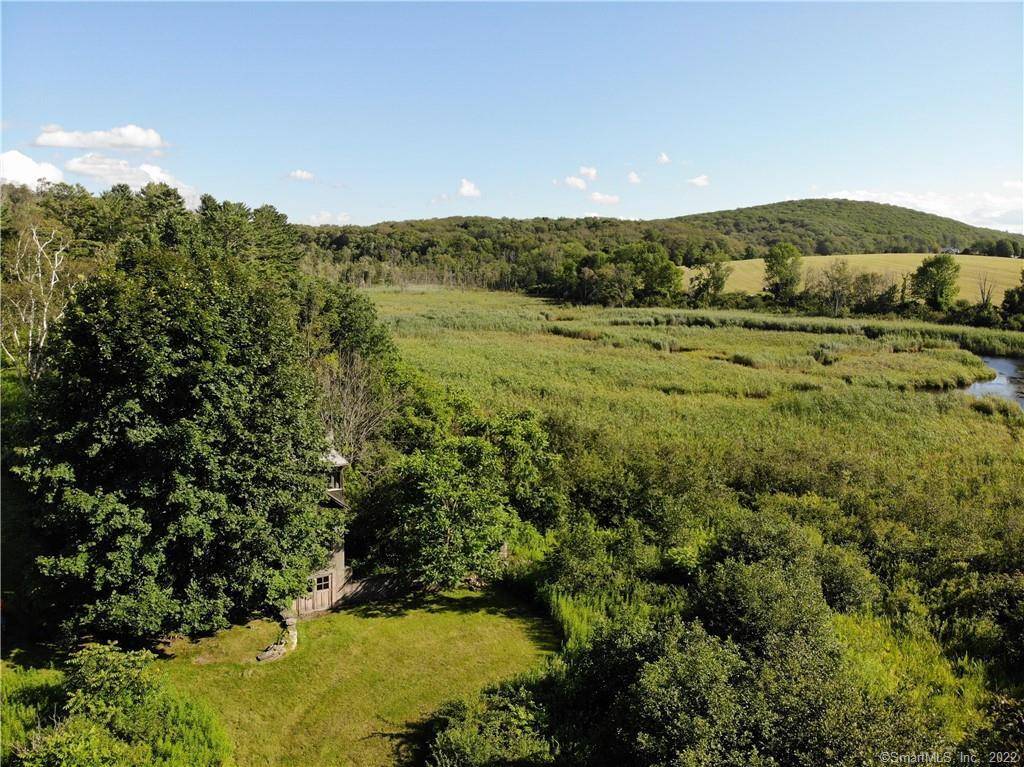 This property offers the opportunity to build a home in Sharon that features both privacy and the enjoyment of a wildlife sanctuary.
