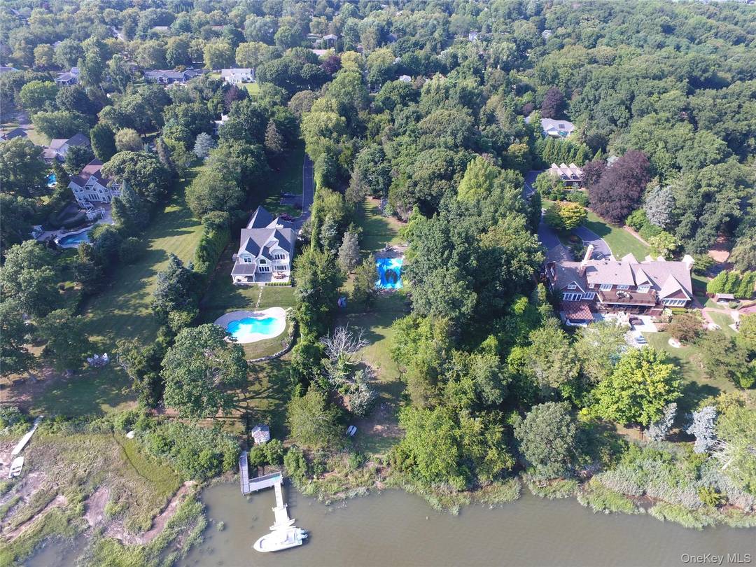 Existing Home and Land with Grandfathered Boat House and Boat Ramp.