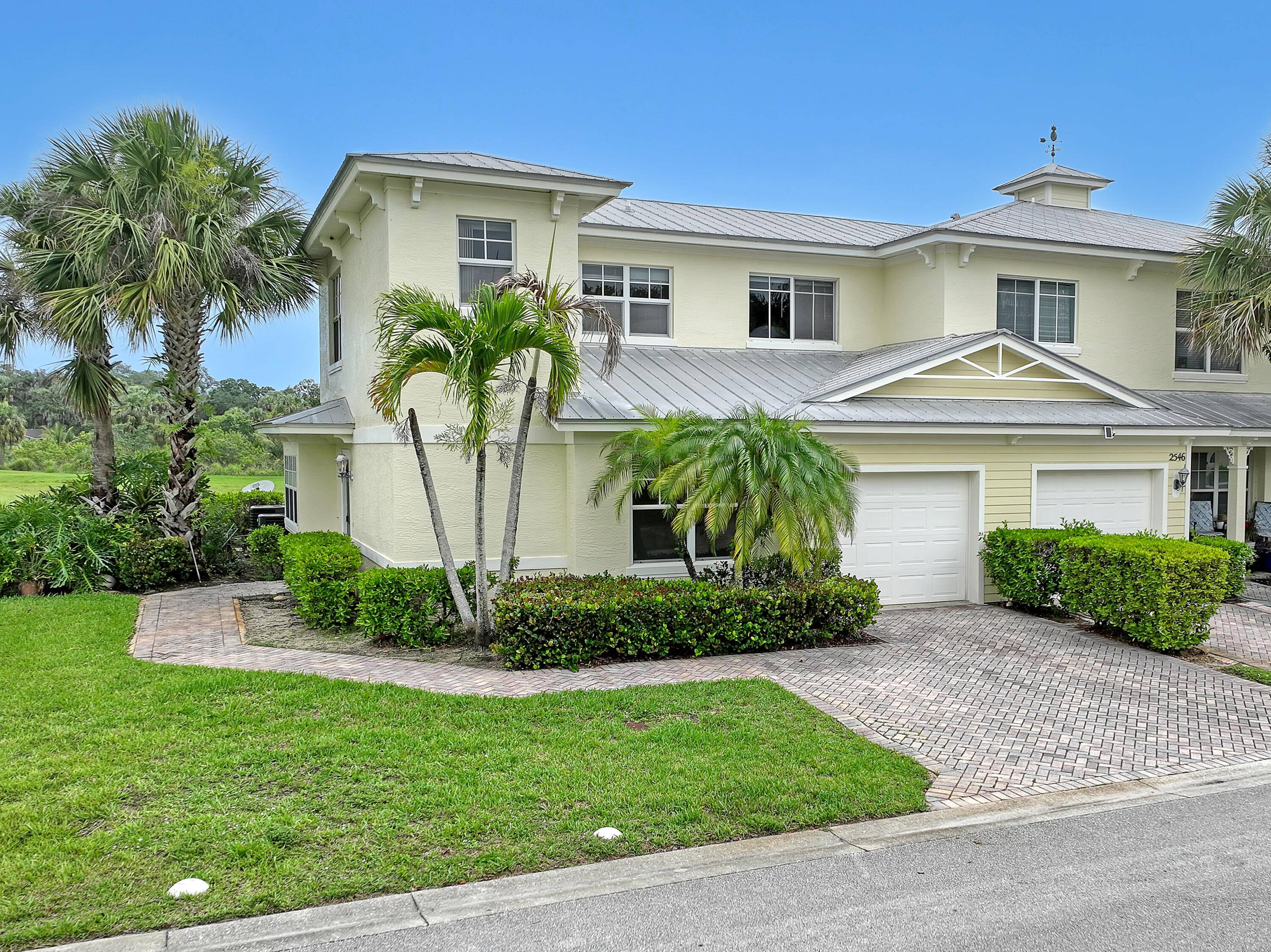 End unit with metal roof in River Oaks !
