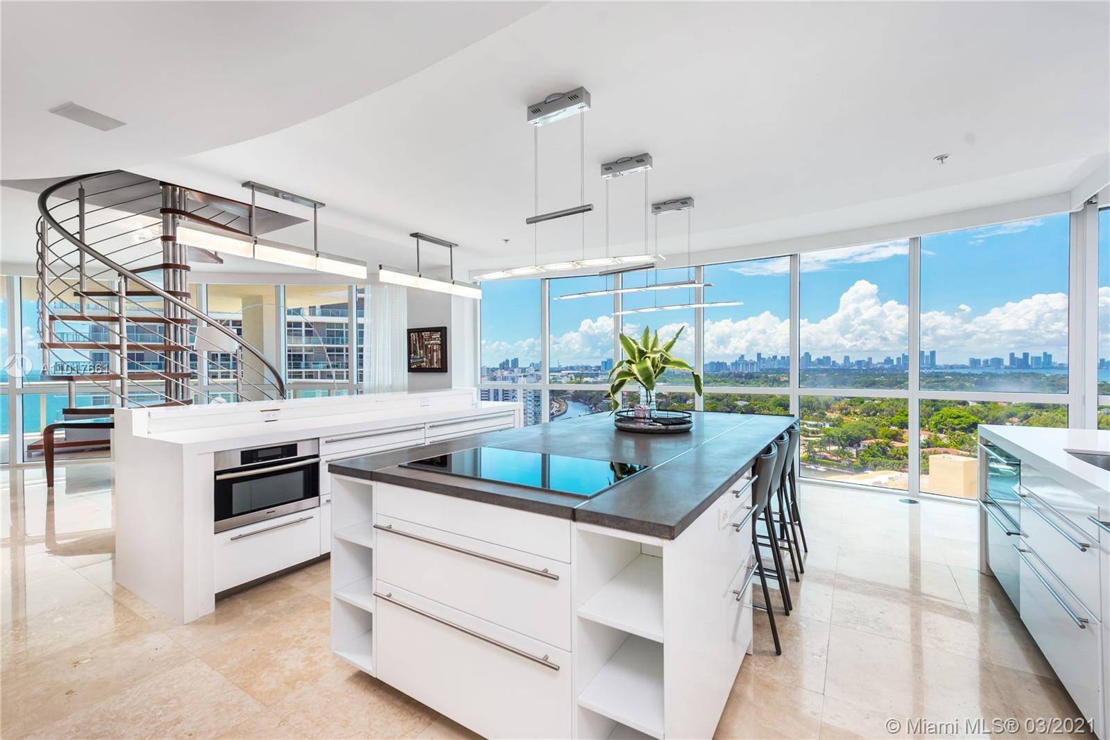Impeccable corner 4 bedroom, 4 bathroom rare penthouse gem at the Mosaic in Miami Beach.
