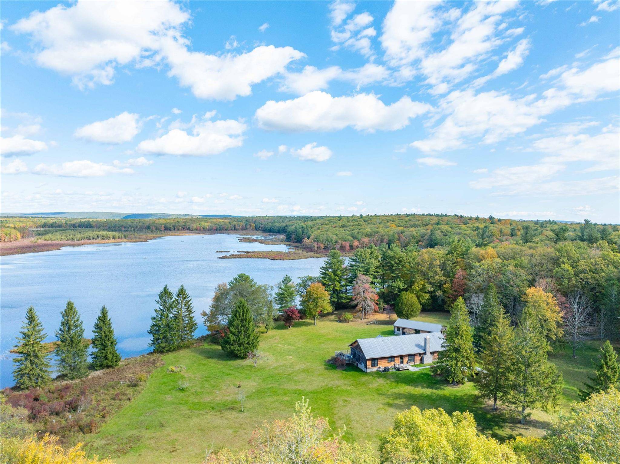 Arrive to nature's doorstep at 3 Big Lake Road, a beautifully renovated 4 bedroom, 3 bathroom lakeside cottage on 700 picturesque acres.