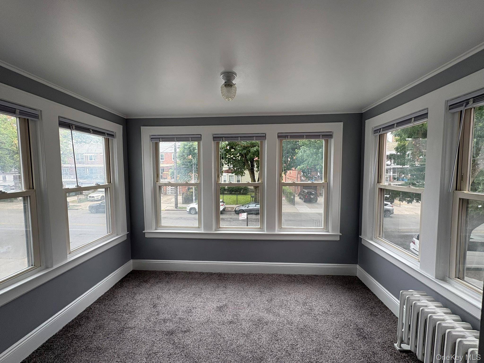 Newly renovated in 2025, this bright and spacious 3 bedroom, 1 bath home is located on the second floor of a charming two family in the heart of Flushing.