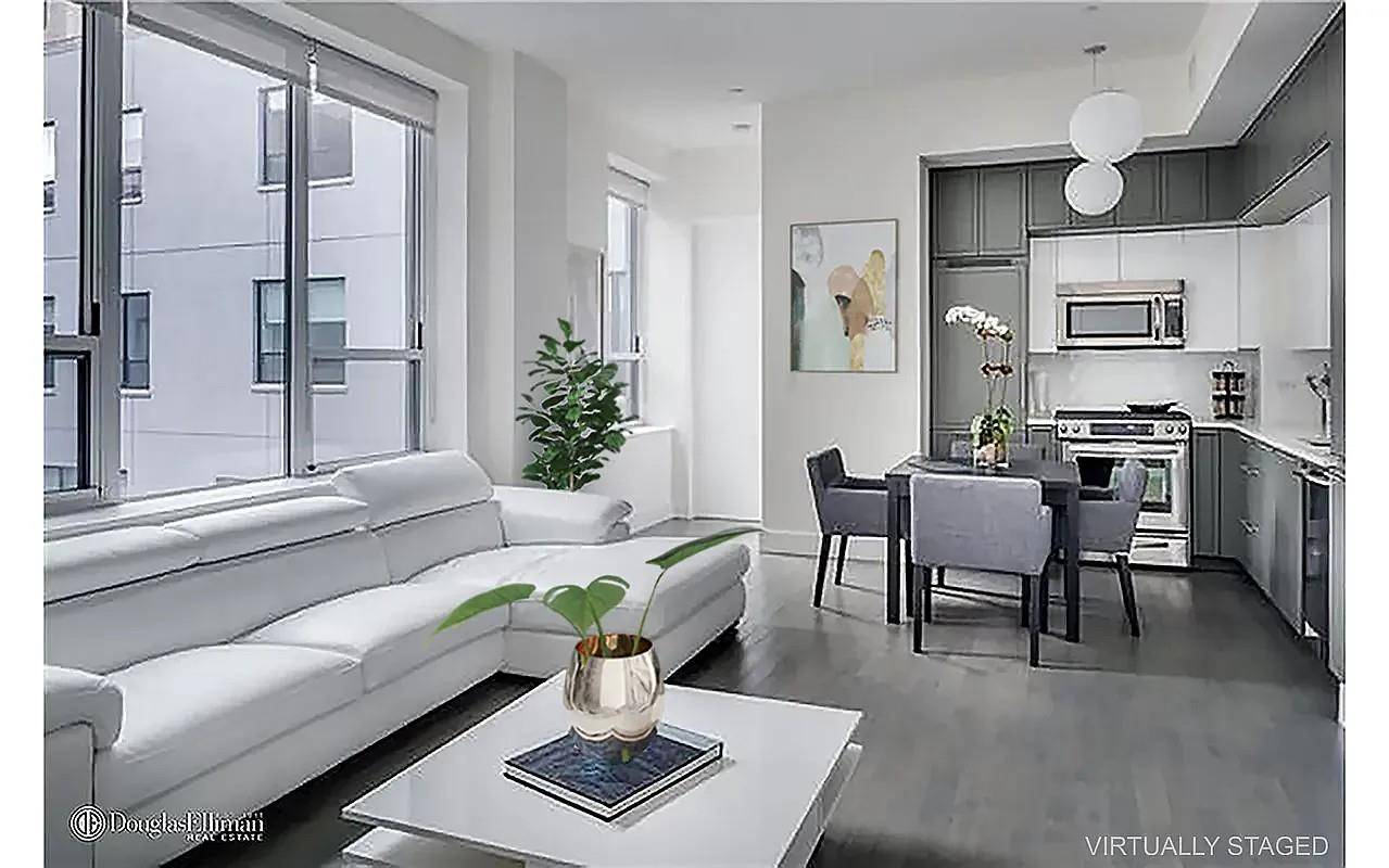This bright split two bedroom, two bath apartment has an open living amp ; dining space, southern exposure, nine foot plus ceilings, and white oak floors throughout.