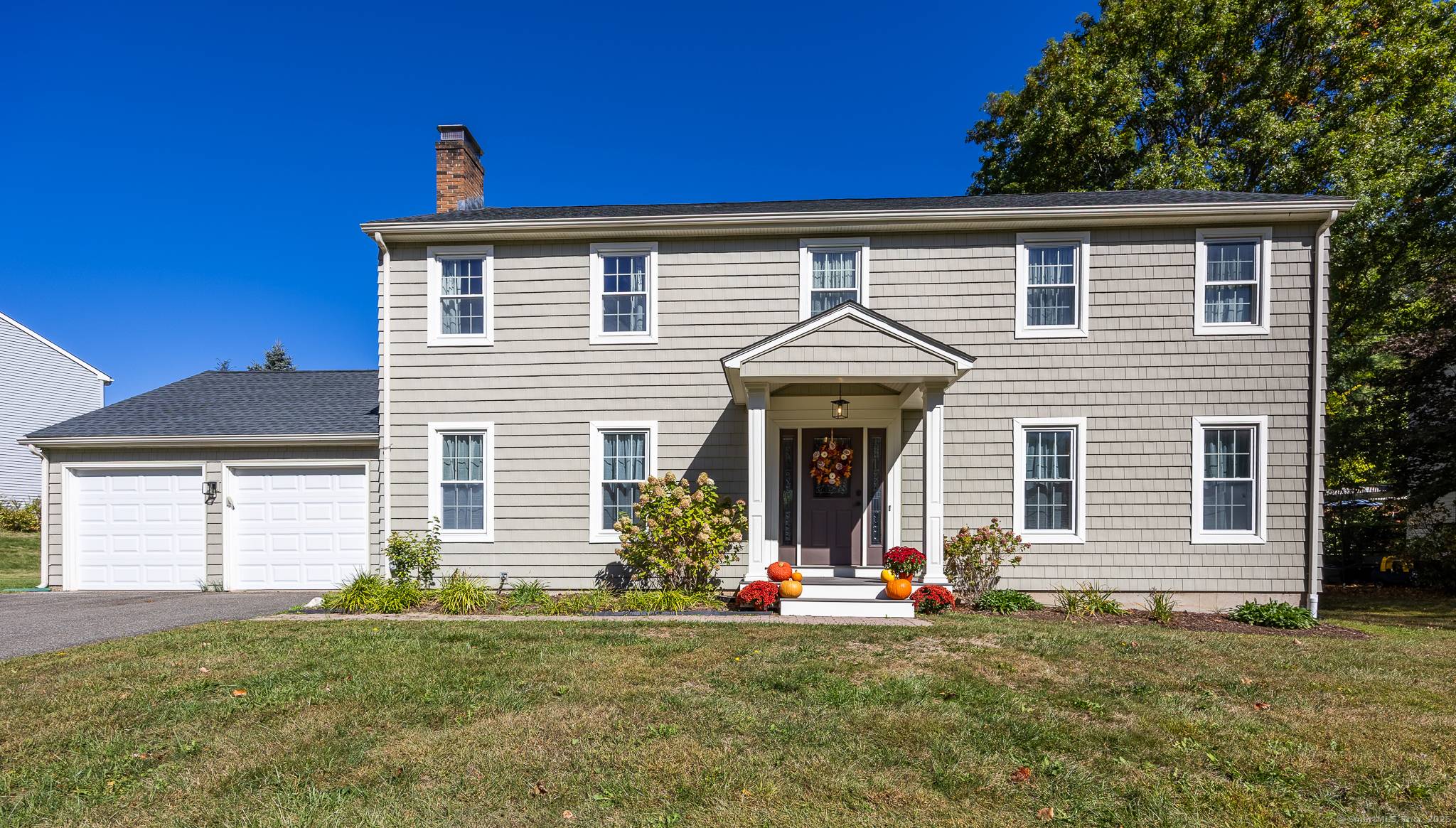 Nestled in desirable and centrally located Cheshire neighborhood, this beautifully maintained and thoughtfully updated 4 bedroom, 2.