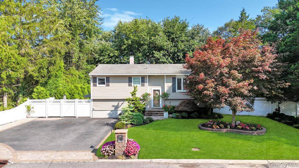 Welcome to this impeccably maintained High Ranch, offering 4 spacious bedrooms, 3 full bathrooms, and a possible 5th bedroom perfect for guests, a home office, or flexible living space all ...