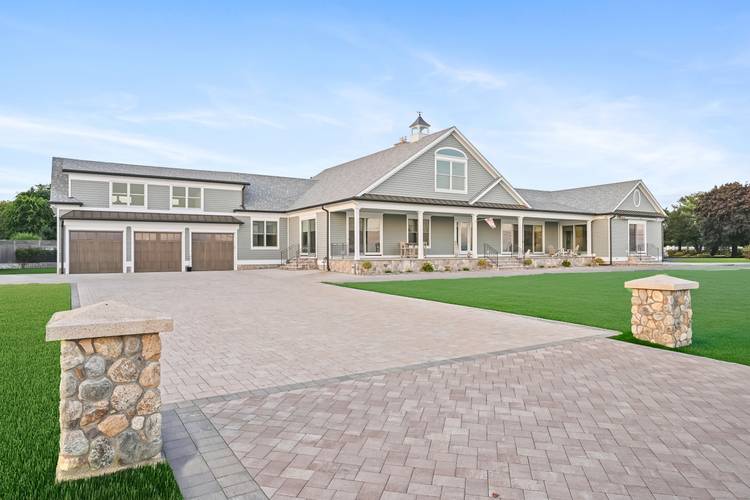 Coastal charm and luxurious one level living define this custom 3, 700 sq.