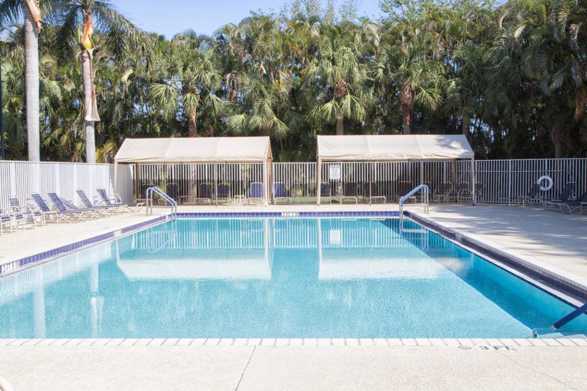 55 community. WOW Spacious upgraded, immaculate, with soaring vaulted ceilings, newer air conditioning appliances, refrigerator, newer washer dryer, newer air conditioning, newer accordion hurricane shutters throughout.