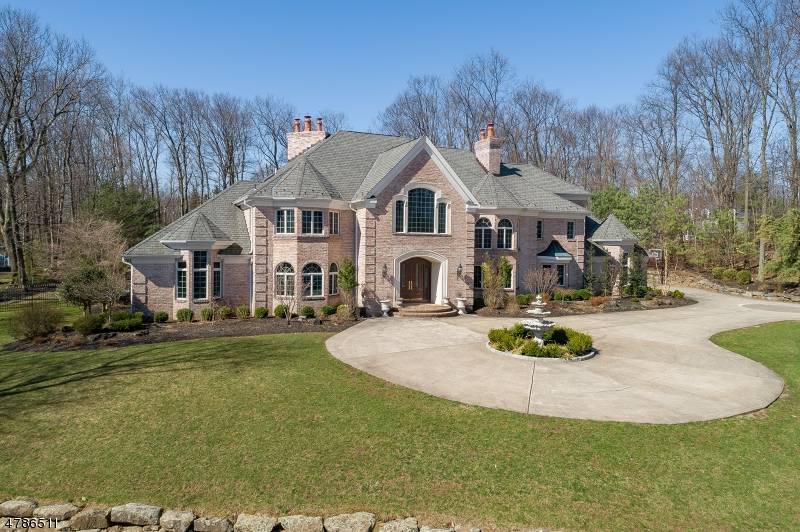 An exceptional offering, this custom home on a serene cul de sac BOAsts over 9, 000 sq.