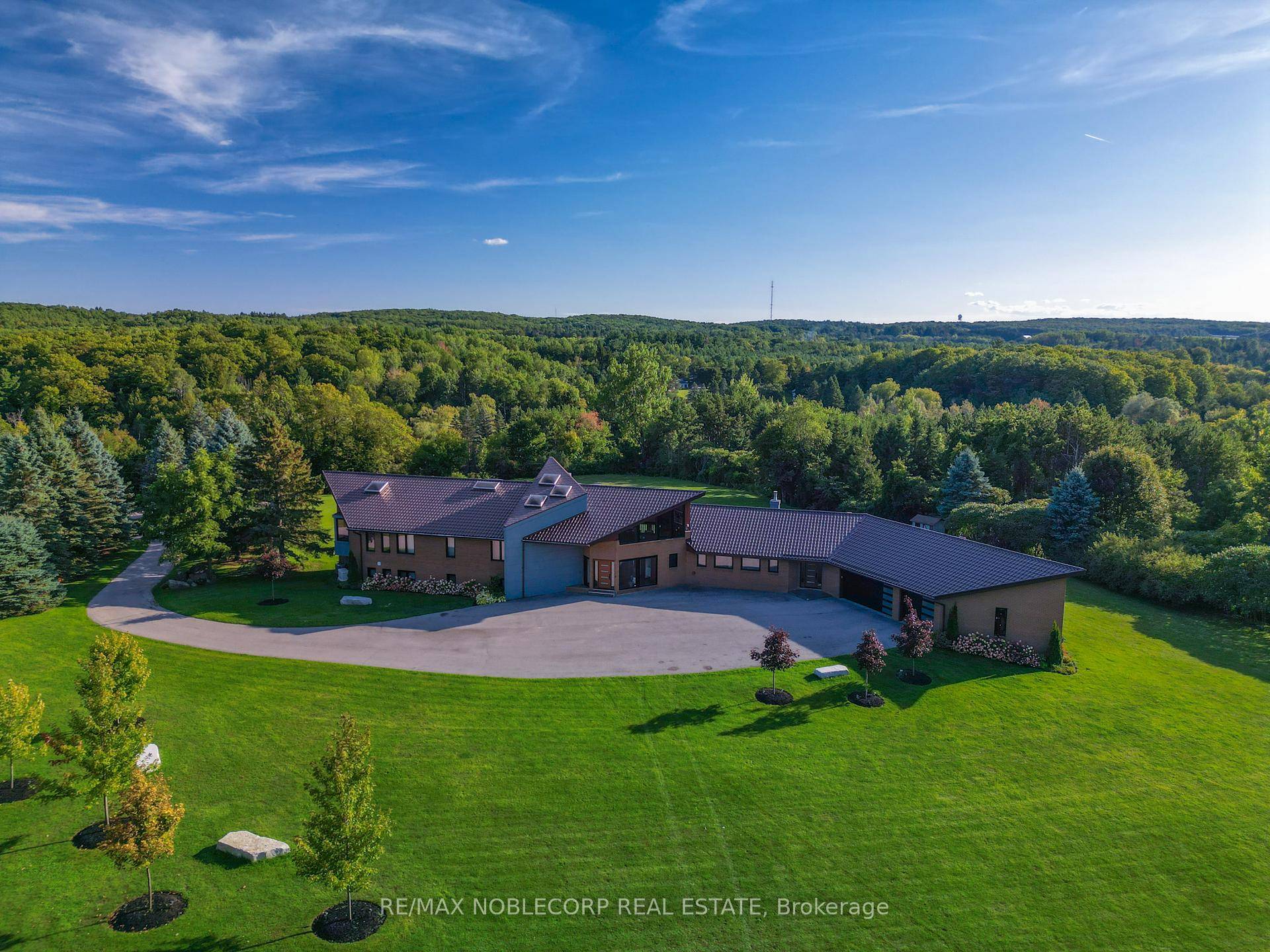 An extraordinary private estate nestled on nearly 5 acres of flat, manicured land in the heart of King City.