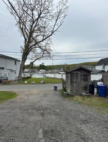 Multi Family Residence located directly across from preserved town property which give this house a beautiful Lake view.