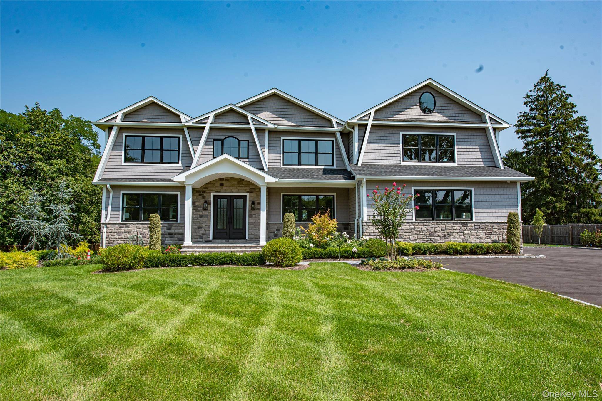Enter This Majestic Home Through Oversized Double Doors Into A Bright Vaulted Foyer Welcomed By A Dramatic Bridal Staircase And 10 Foot First Floor Ceilings !