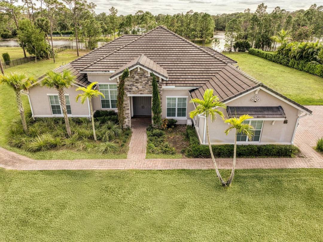 Nestled in the heart of Jupiter Farms, this stunning Reynold's Ranch home offers the perfect blend of modern living and natural beauty.