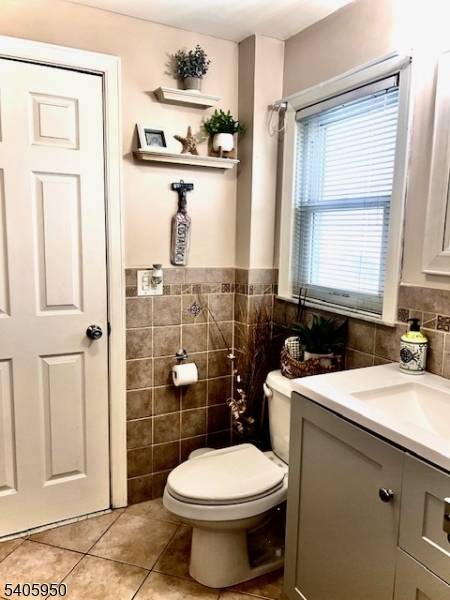 This beautiful single residence boasts a charming interior, with a cozy living room, formal dining room, and kitchen situated on the first floor.