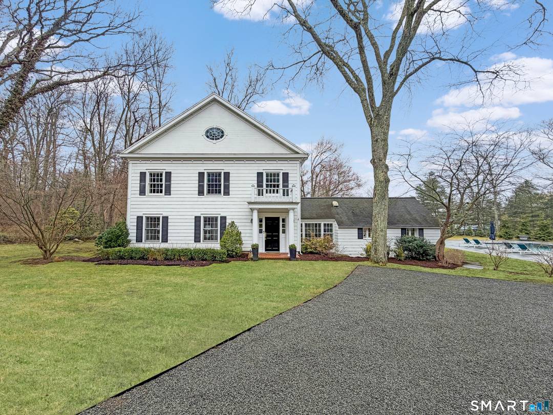 A gated entry introduces this stunning Federal style Colonial, privately set on just over 2 acres.