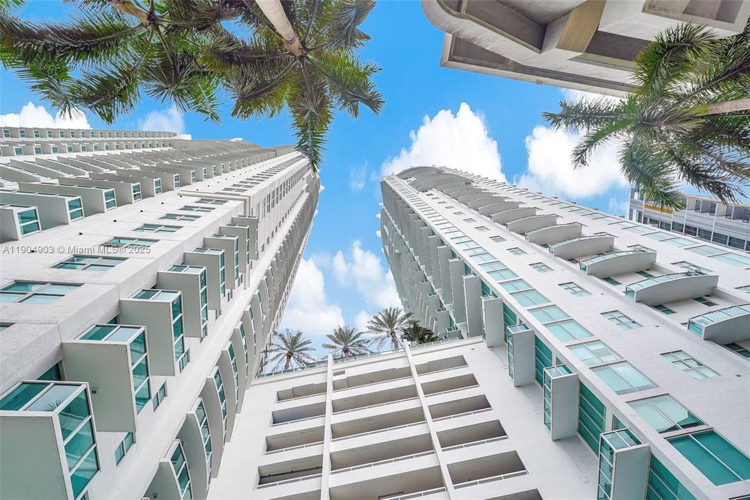 Experience vibrant city living in this stunning 2 story corner loft at Brickell on the River South.