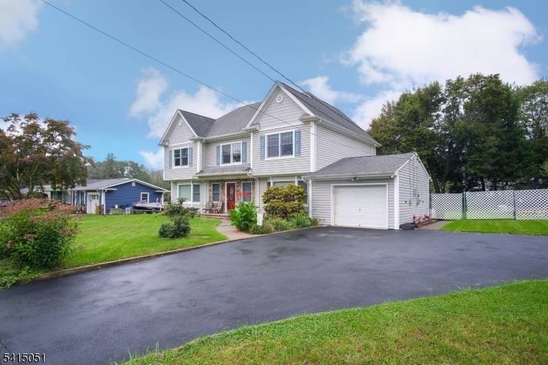 This beautifully expanded 5 bedroom Colonial offers space, flexibility, and comfortable living in a quiet neighborhood with a terrific level backyard.